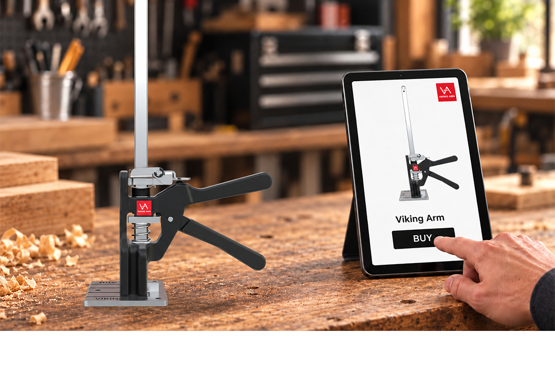 Viking Arm lifting tool on a workbench beside a tablet, with a hand tapping the Buy button.